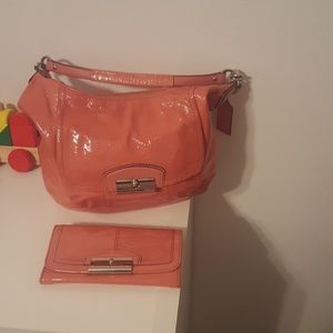 pink coach handbag and wallet